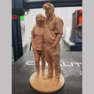 Custom scanned figurine of a couple 3D printed with wooden filament