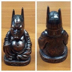 Front and back views of a 3D printed and electroplated Batman buddha